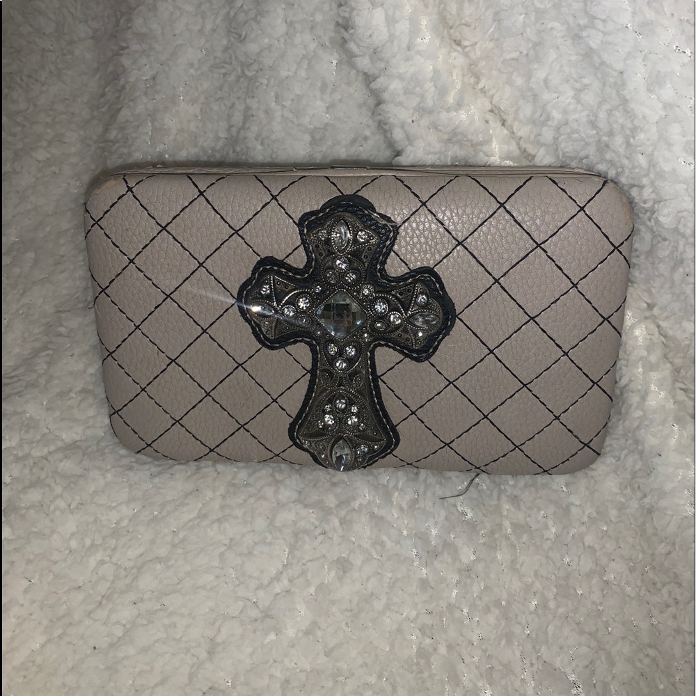 Snap open wallet with Cross on it.